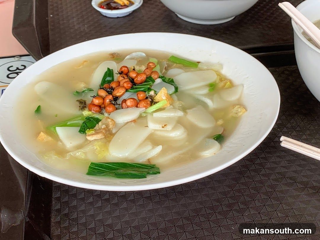 Bowl of Noodle Soup with Tofu and Greens