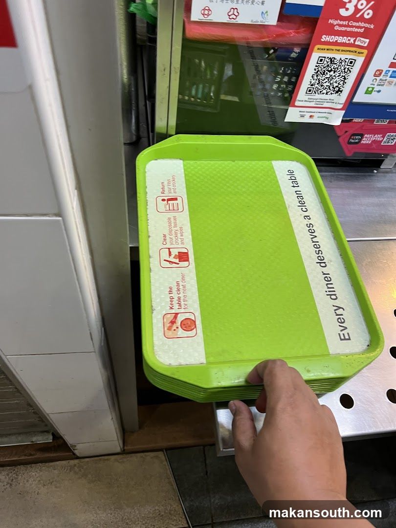 Green tray with cleaning instructions