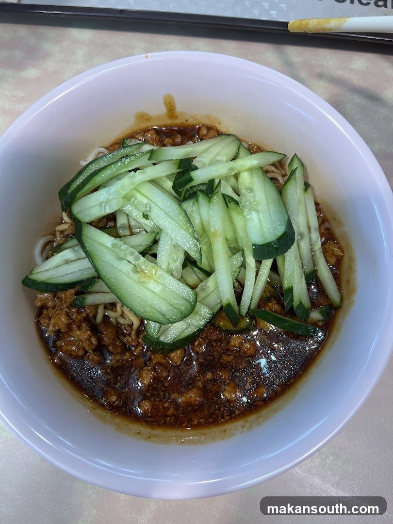 Bowl of Noodles with Cucumber and Sauce