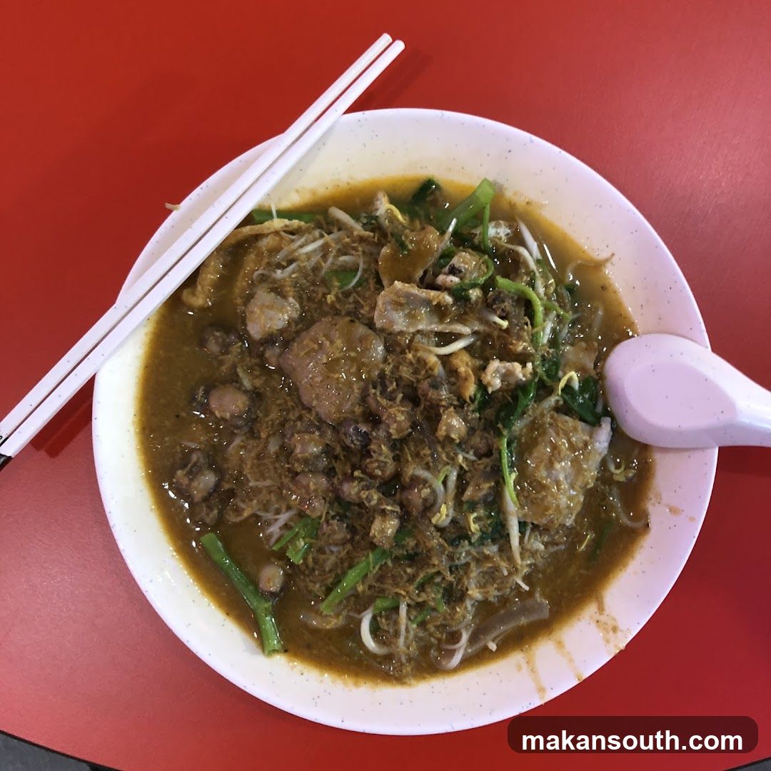 Bowl of Noodle Soup with Chopsticks and Spoon