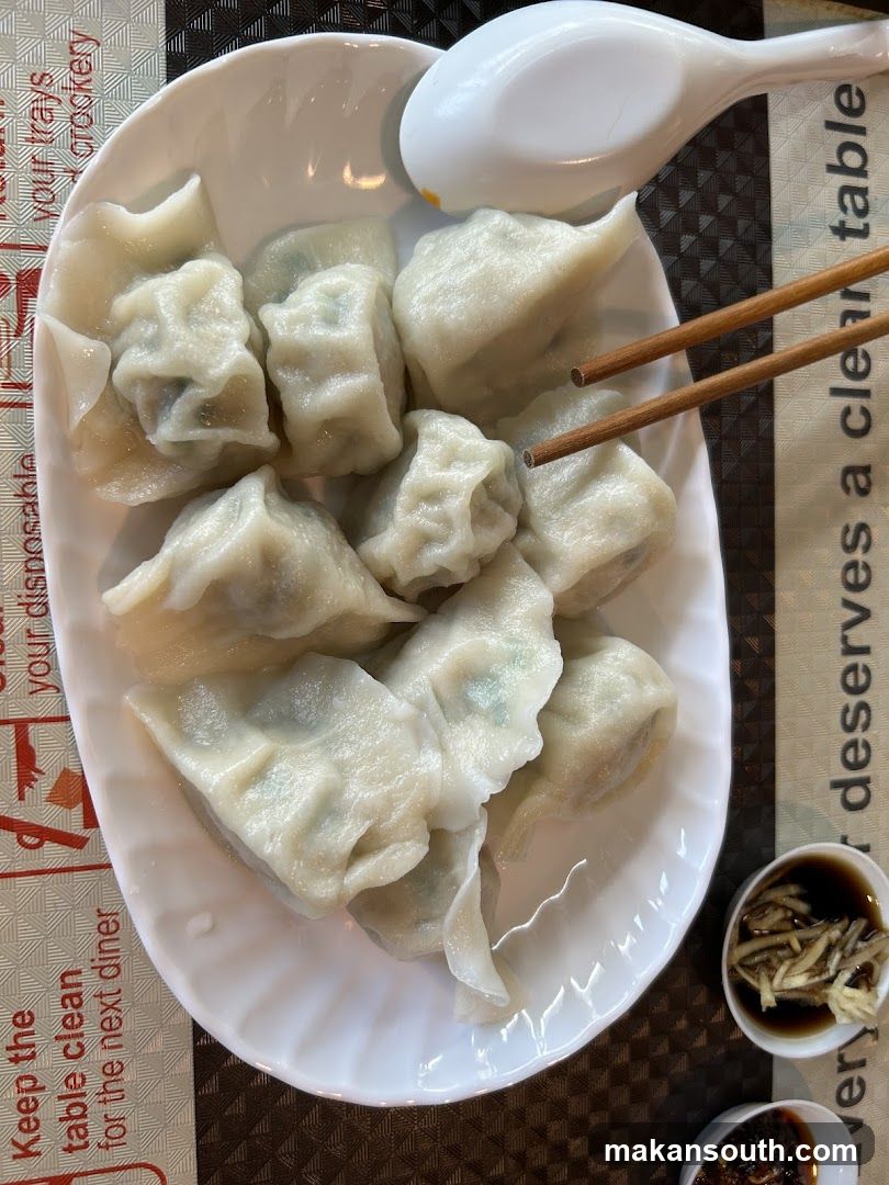 Dumplings with Chopsticks and Sauce