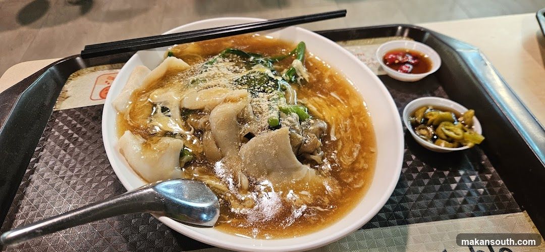 Bowl of Noodles with Side Dishes