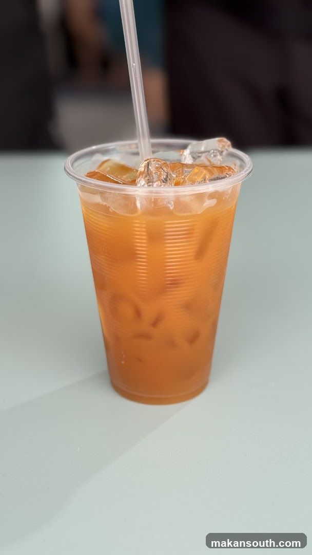Iced Orange Drink in Plastic Cup