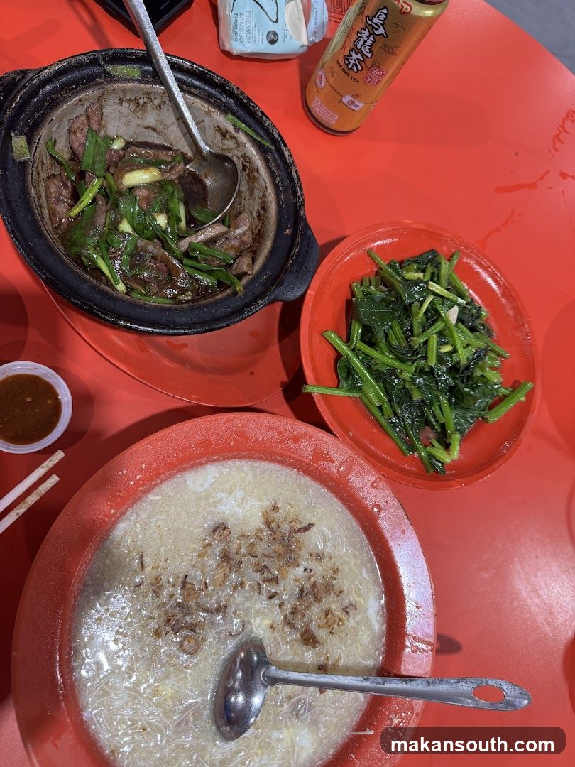 Food Table with Clay Pot Dish and Side Dishes