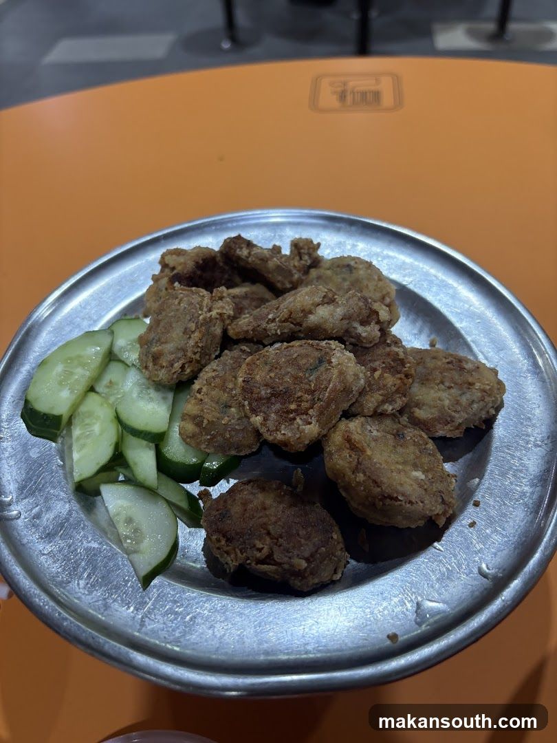 Fried Food with Cucumber Slices