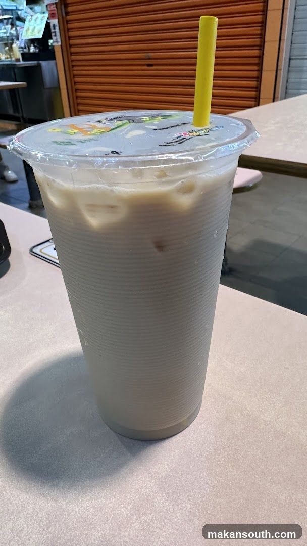 Iced beverage with yellow straw