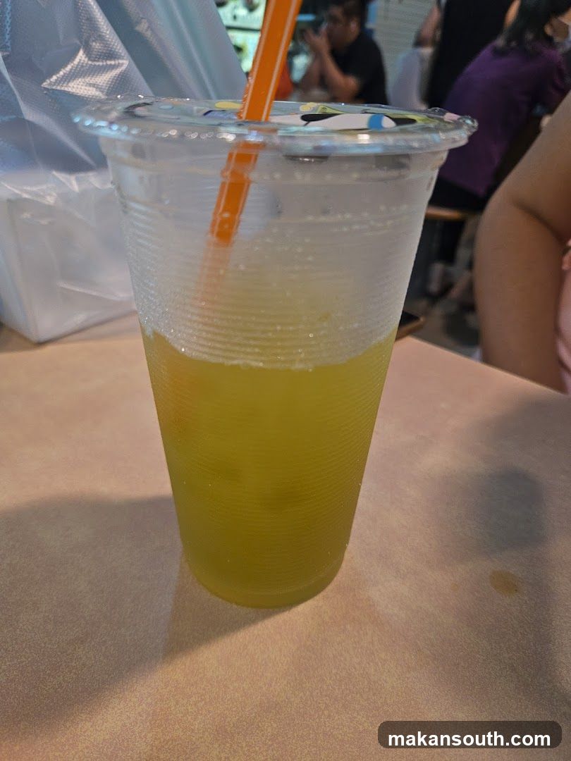 Yellow Drink in Plastic Cup
