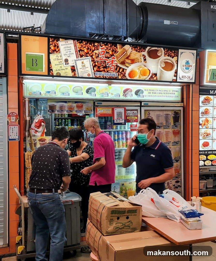 Food stall interior with customers and staff