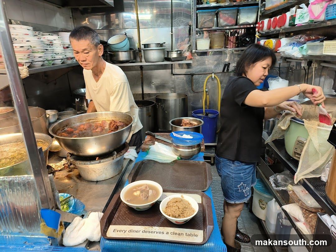 Kitchen Scene with Staff Preparing Food