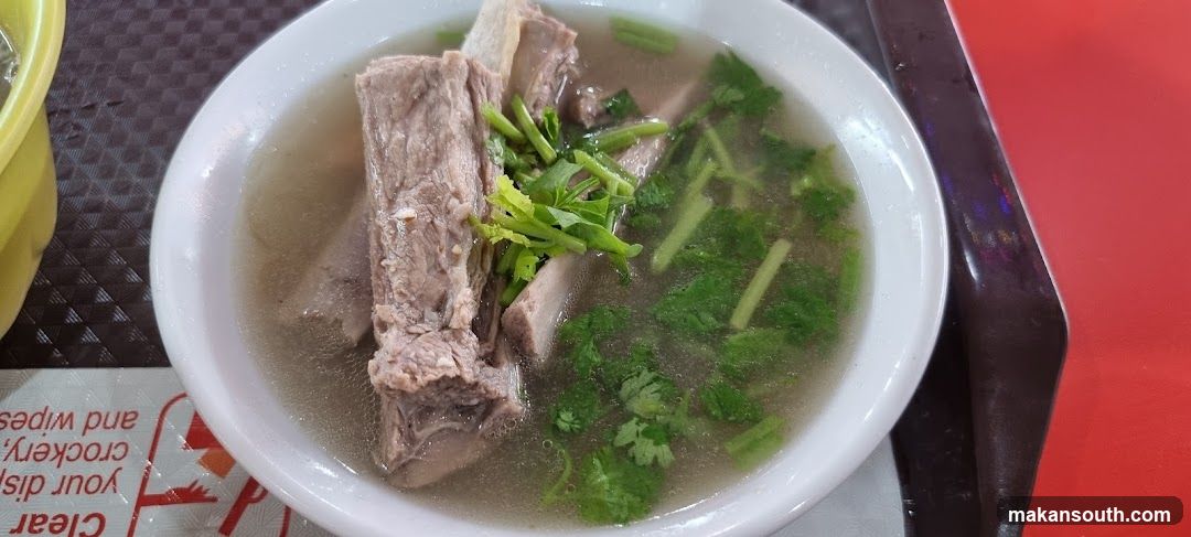 Bowl of Meat Soup with Herbs