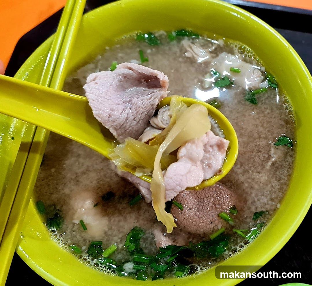 Bowl of Soup with Meat and Greens