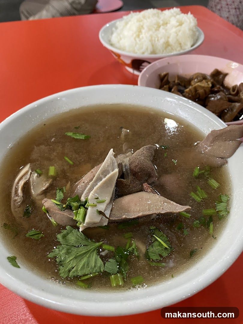 Bowl of Soup with Rice and Side Dish