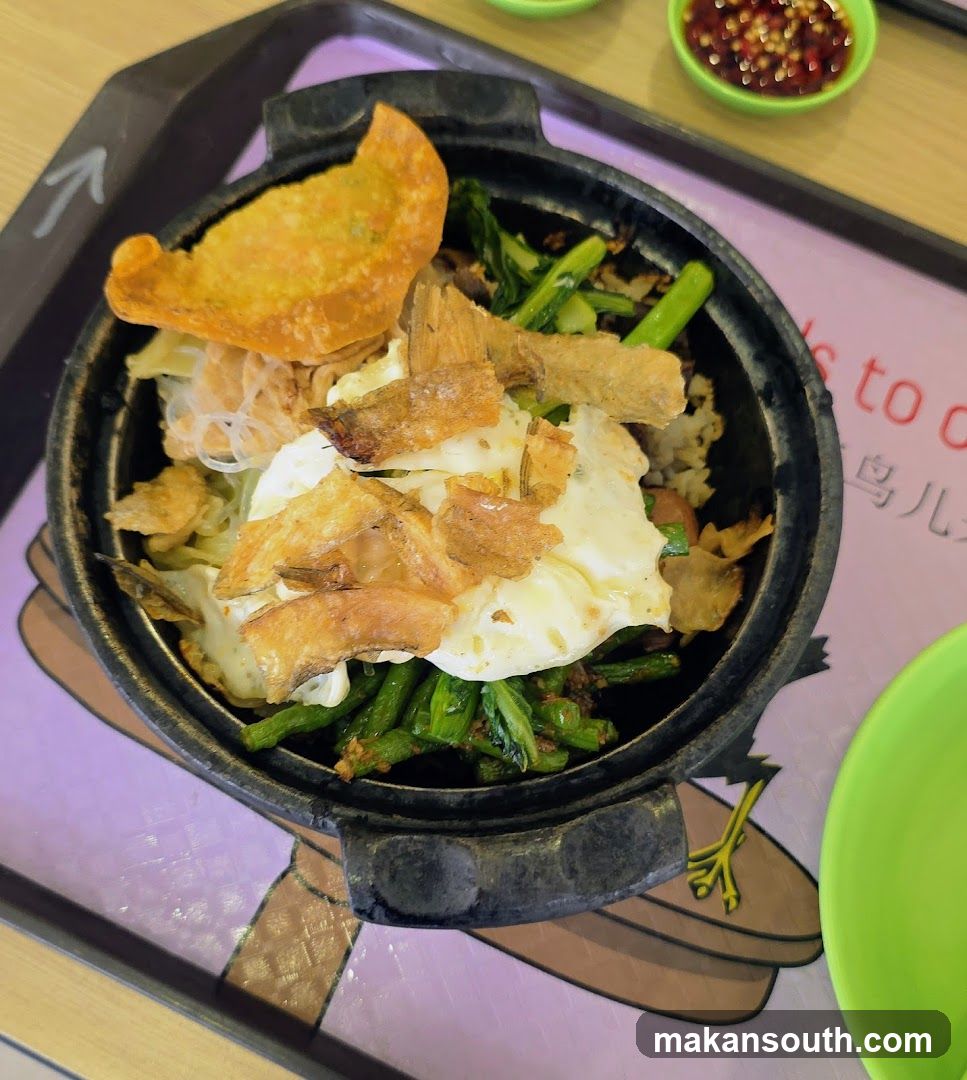 Claypot Rice Dish with Fried Egg and Crispy Toppings