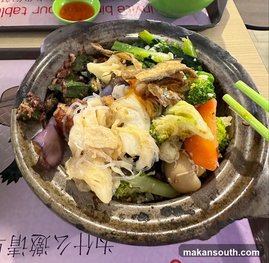 Clay Pot Rice Bowl with Vegetables and Fish