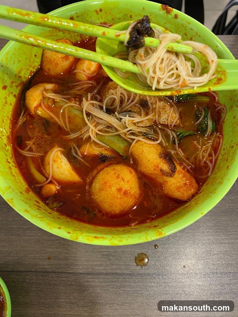 Spicy Noodle Bowl with Fish Balls and Vegetables