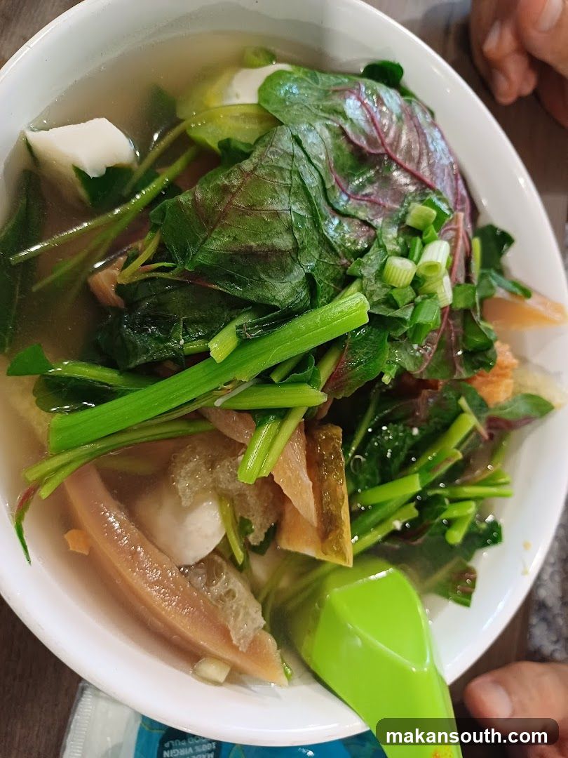 Bowl of Soup with Vegetables and Tofu