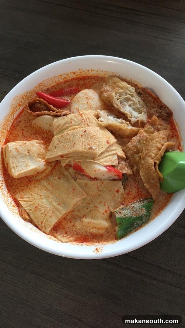 Bowl of Curry Laksa with Tofu and Fish Balls