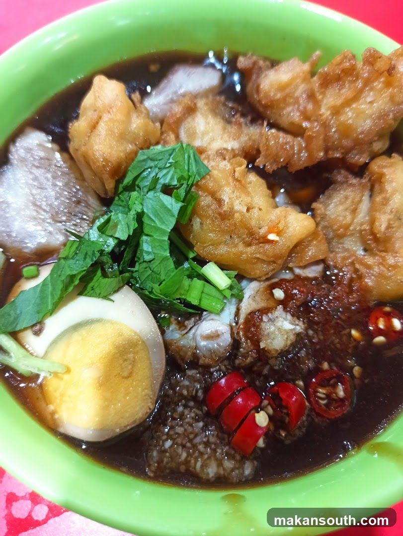 Bowl of Noodle Soup with Toppings