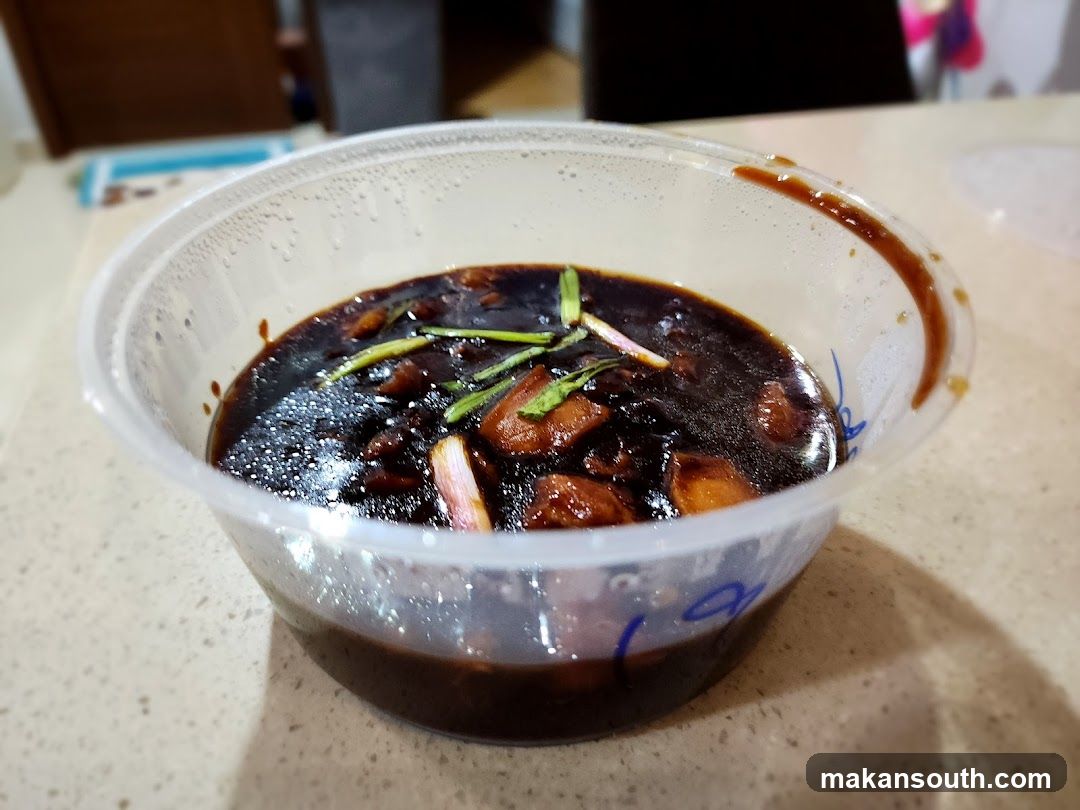 Bowl of Dark Sauce with Vegetables