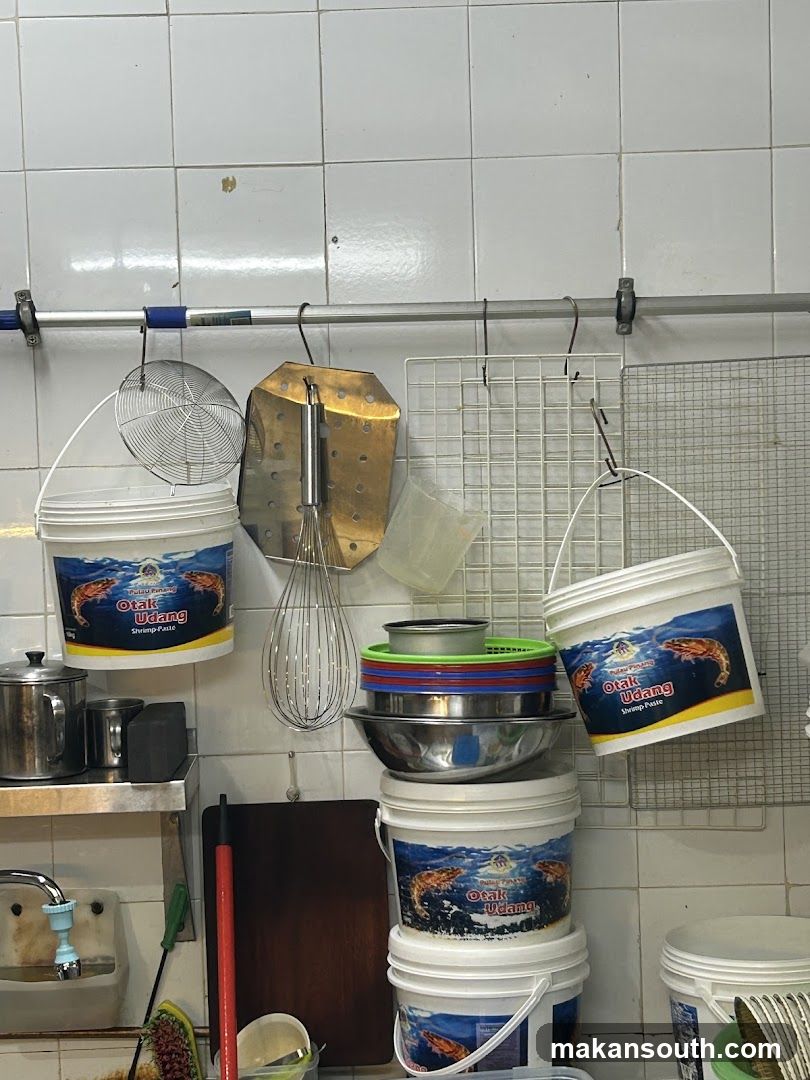 Kitchen Interior with Hanging Utensils and Buckets