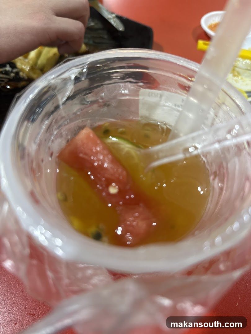 Fruit-infused drink in plastic cup
