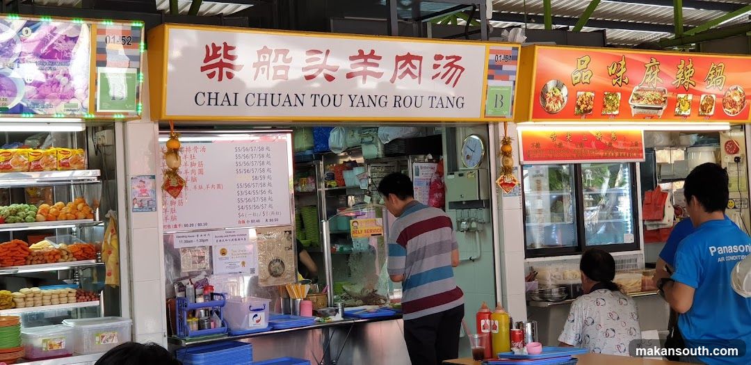 Food Stall Interior with Menu Board and Staff