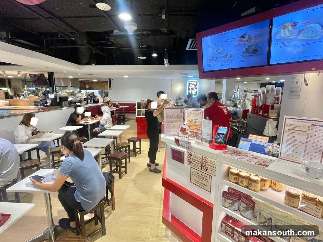 Food Court Interior with Menu Boards and Staff