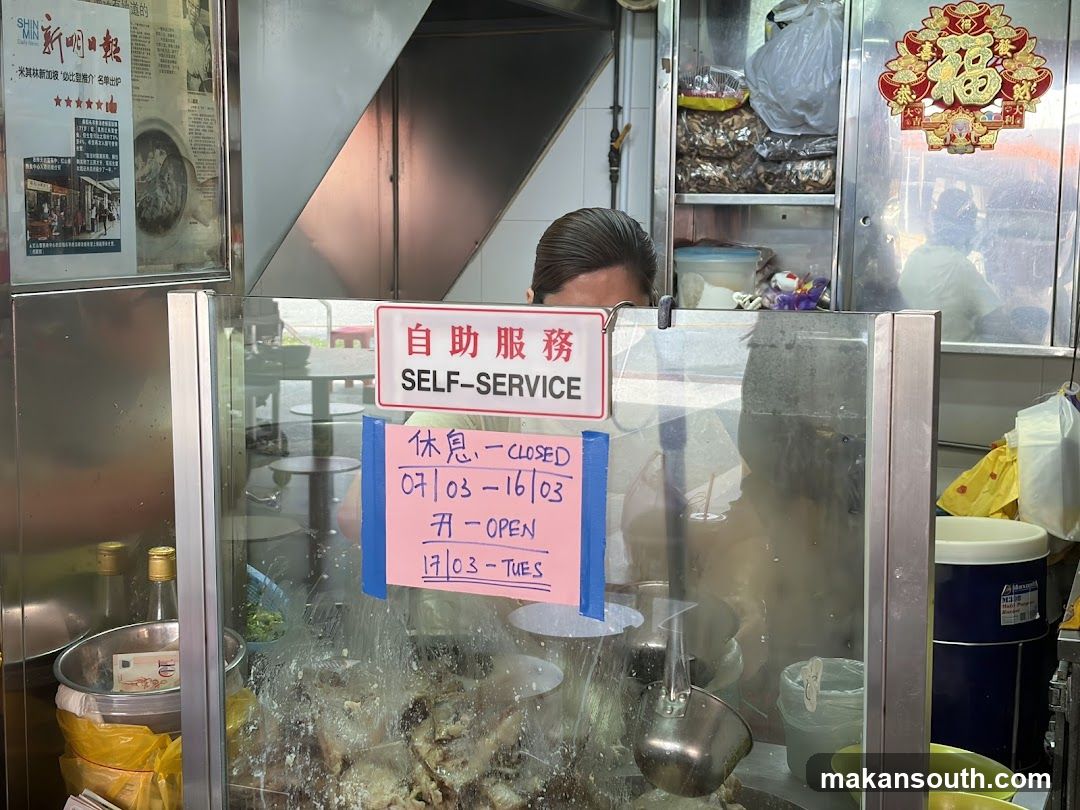 Food stall interior with self-service sign