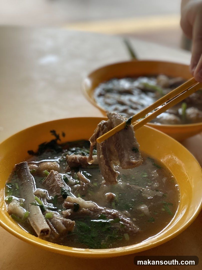 Bowl of Soup with Chopsticks