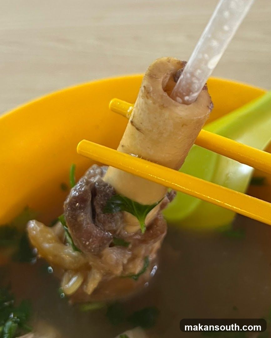Bowl of Soup with Chopsticks