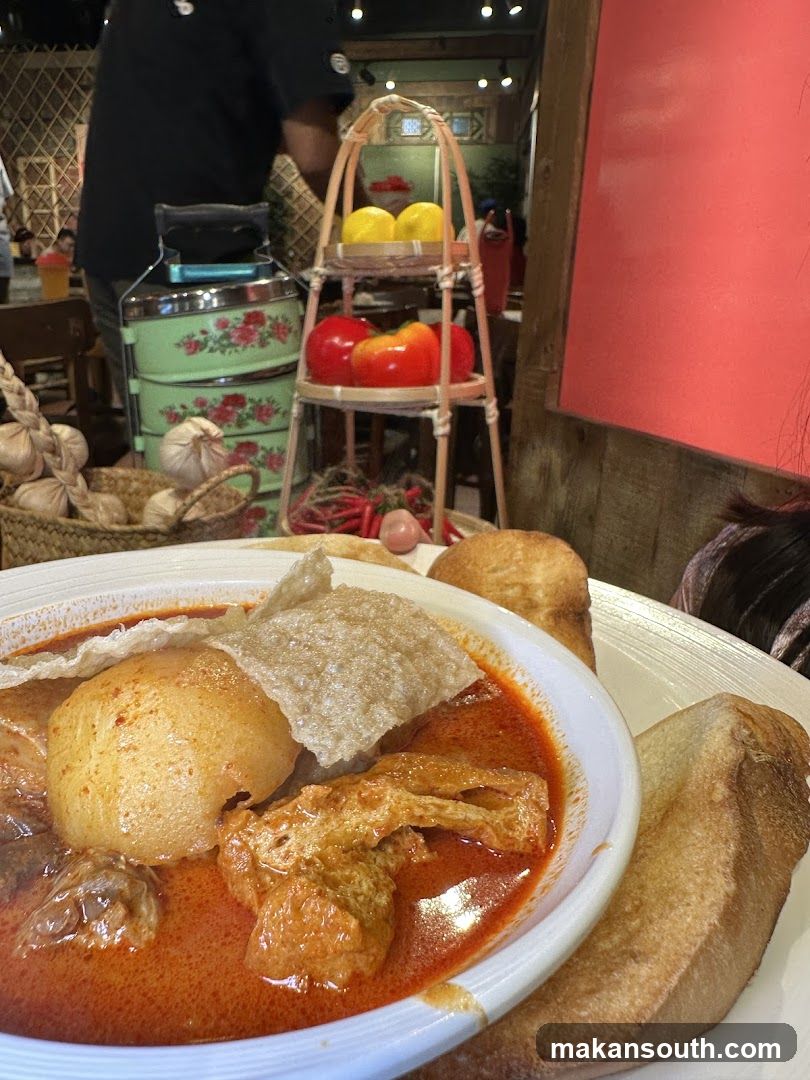Curry Dish with Bread and Garnishes