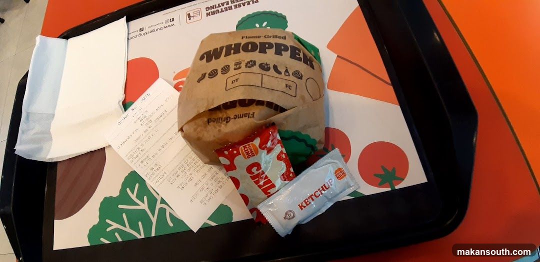 Burger joint tray with Whopper and condiments