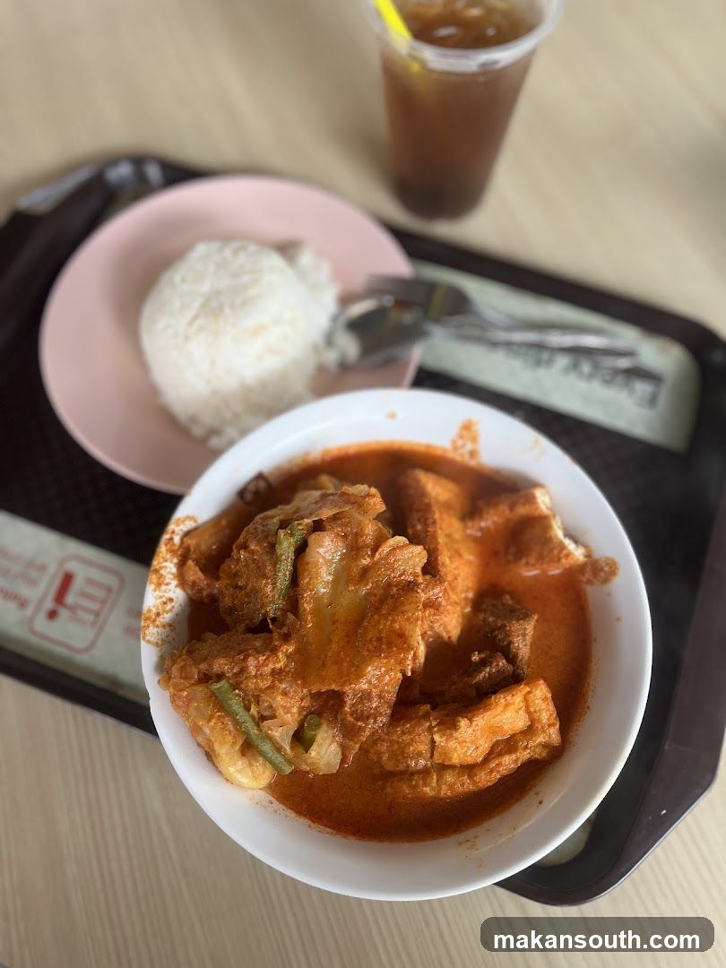 Curry Dish with Rice and Drink
