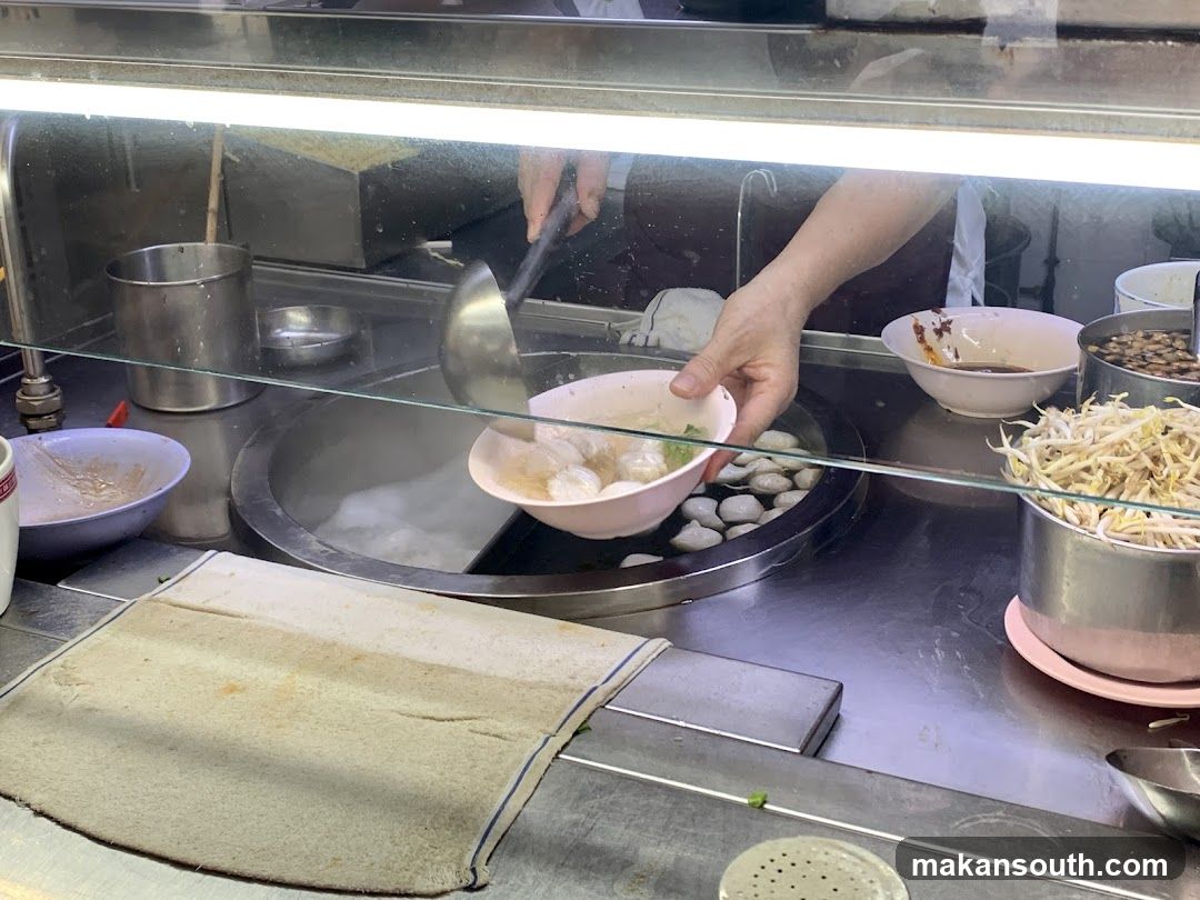 Dish Preparation at Food Stall