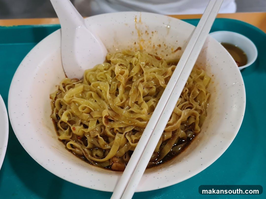 Noodle Bowl with Chopsticks and Spoon