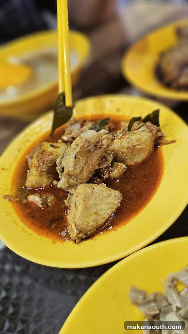 Yellow Plate with Fried Chicken in Sauce