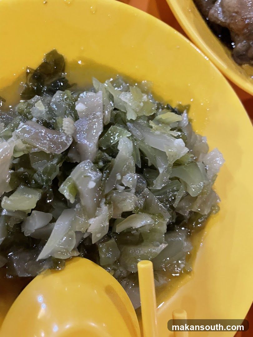 Dish with pickled vegetables in yellow bowl