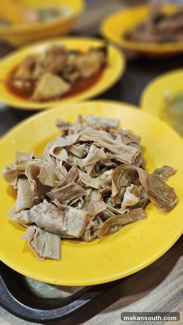 Yellow Plate of Cooked Meat and Tofu Skin