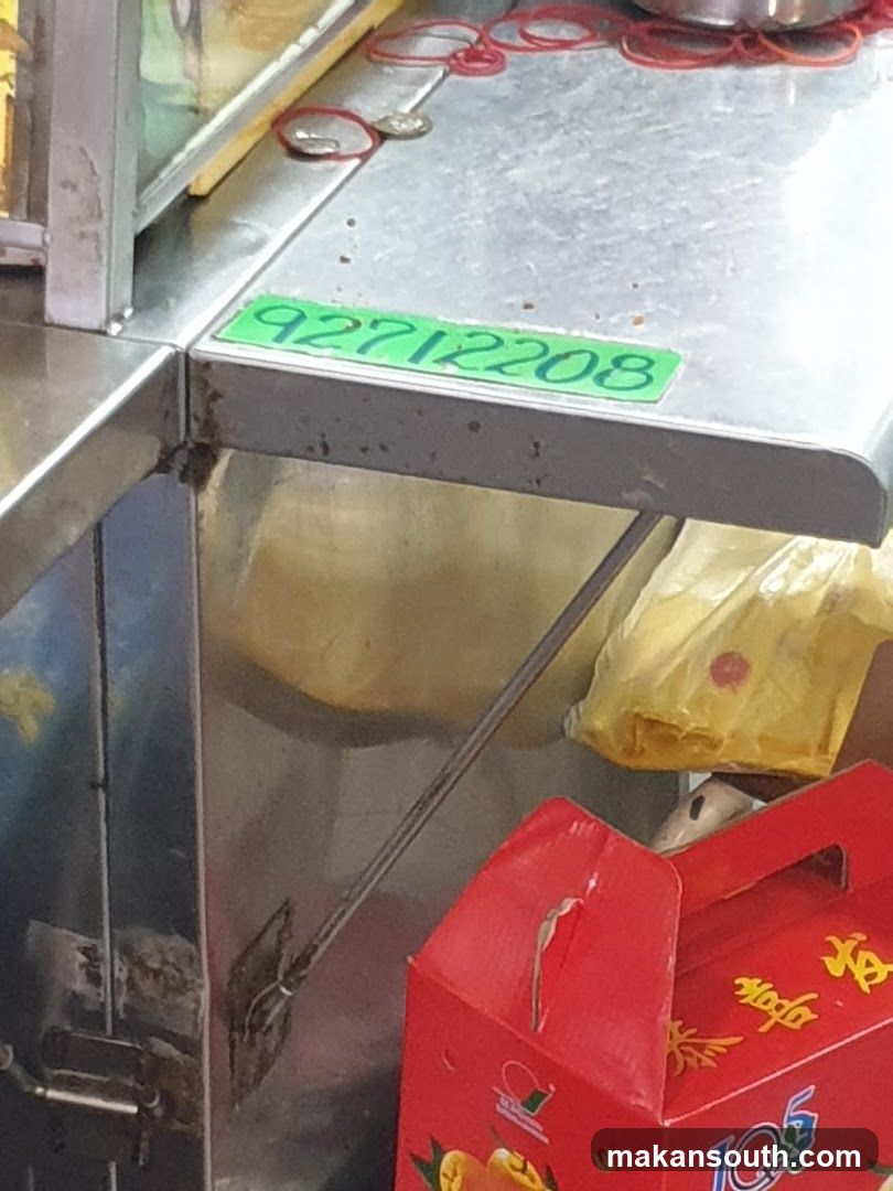Food Stall Counter with Red Box and Yellow Bag
