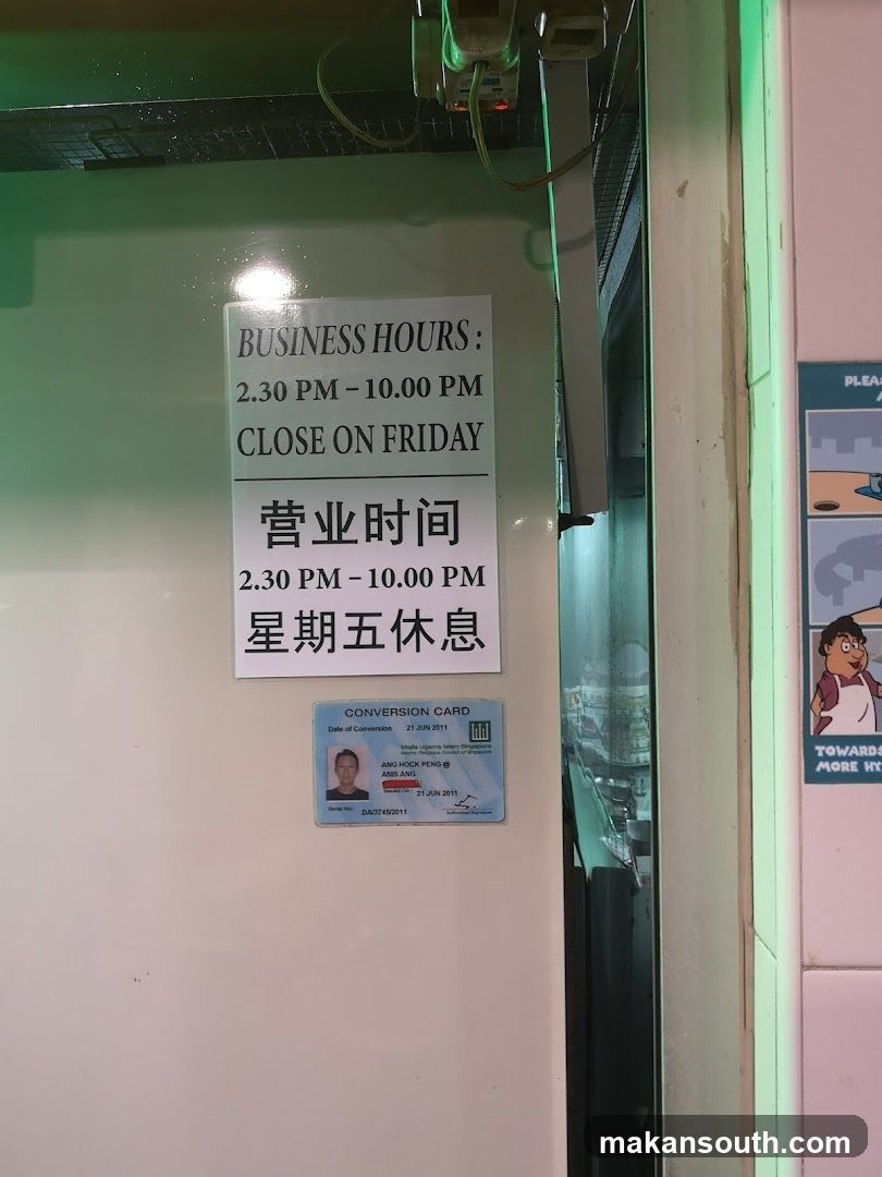 Storefront with Business Hours Sign