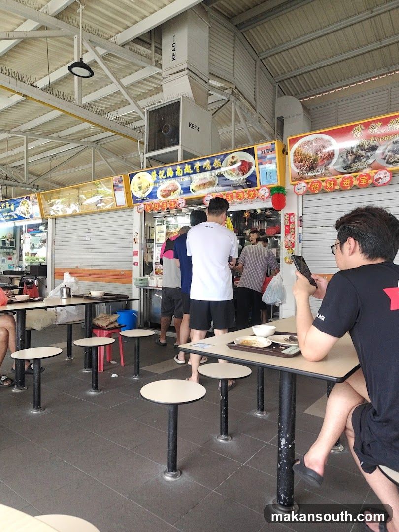 Food stall interior with customers dining and ordering
