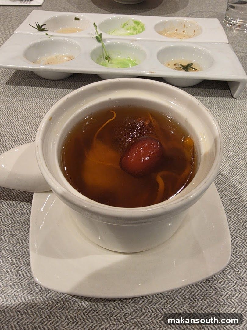 Dish with Soup and Condiments
