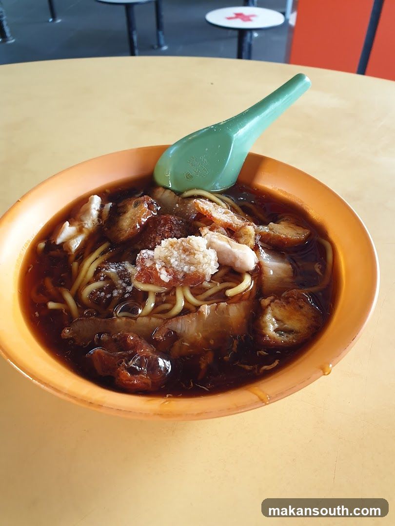 Bowl of Noodles with Green Spoon