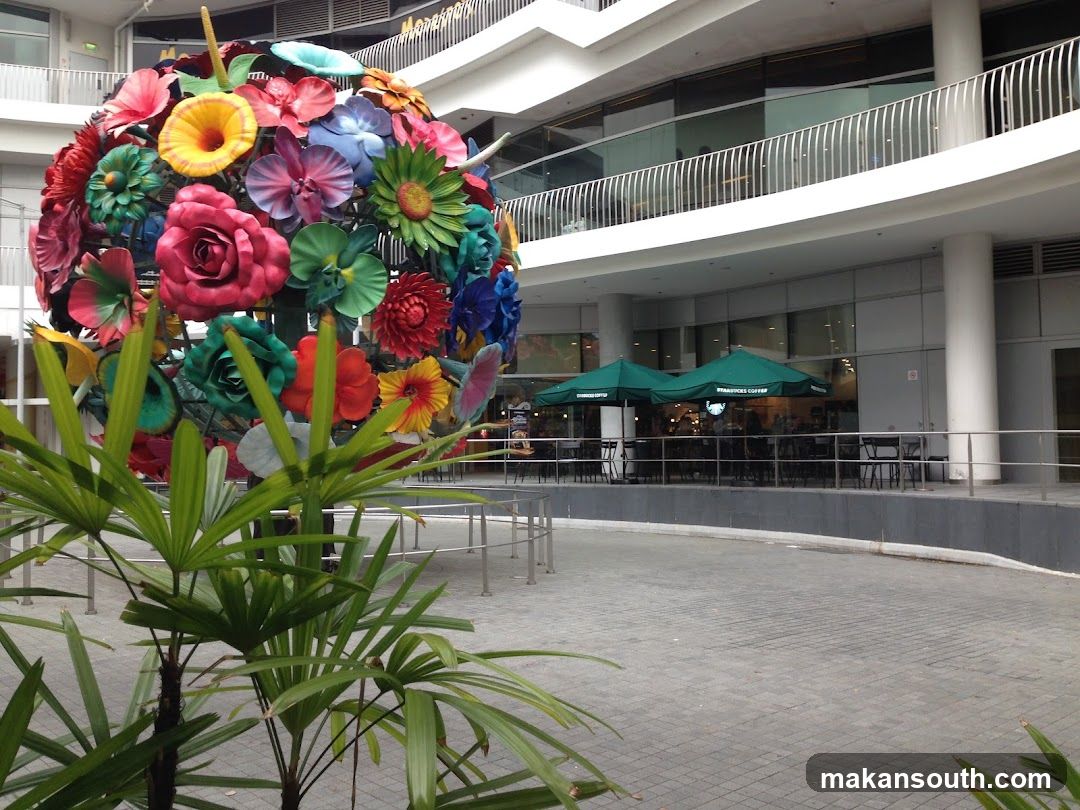 Flower Sphere Sculpture at Modern Building Entrance