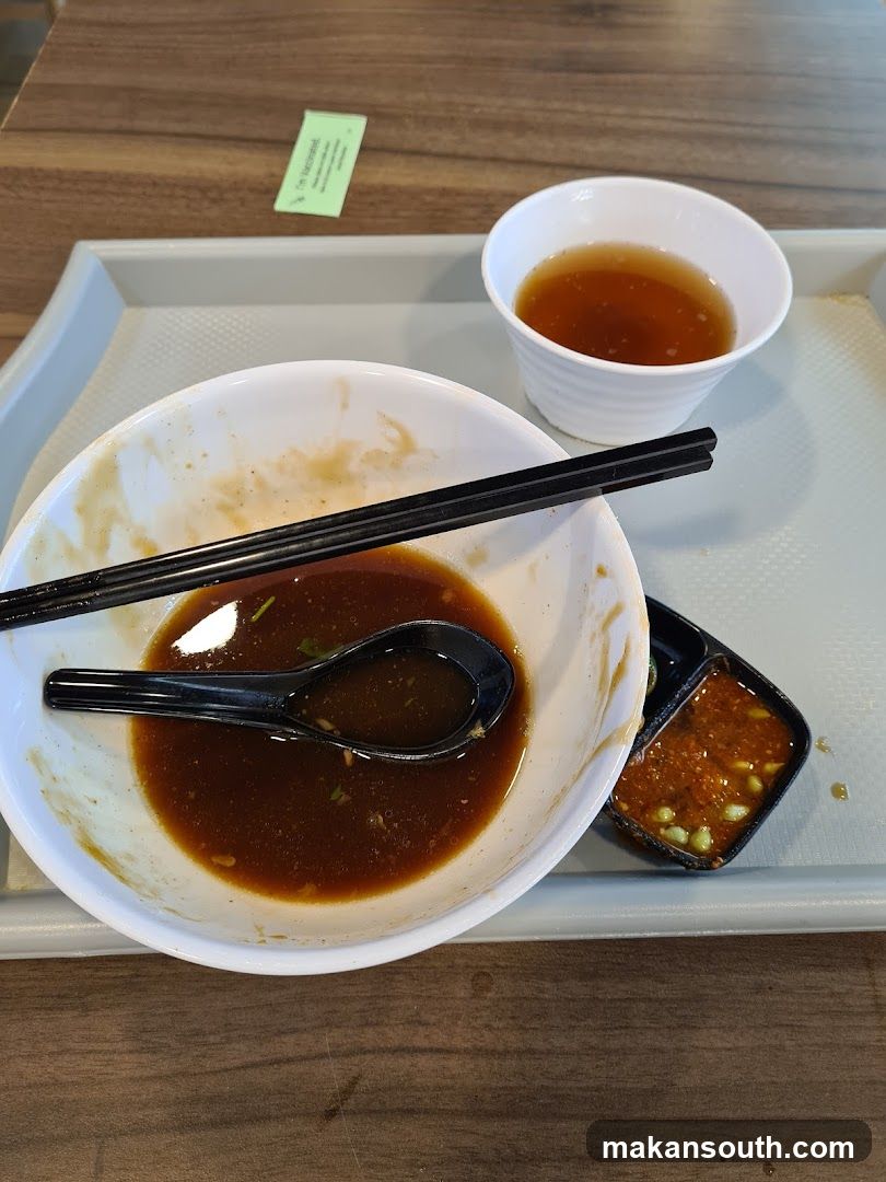 Empty Bowl with Sauce and Chopsticks