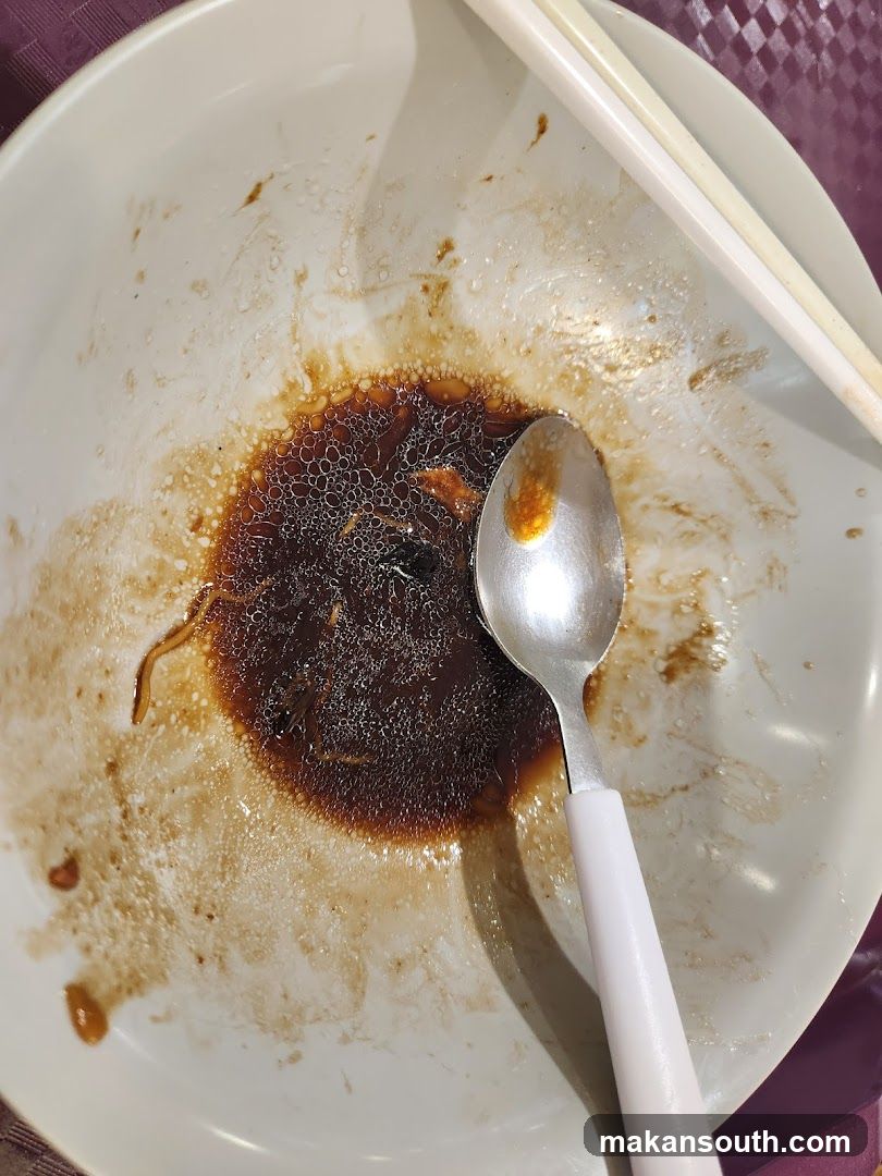 Empty Bowl with Sauce and Utensils