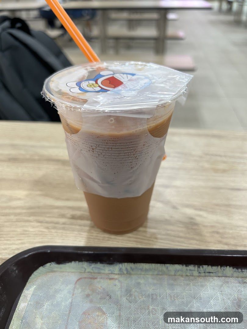 Iced beverage with cartoon lid