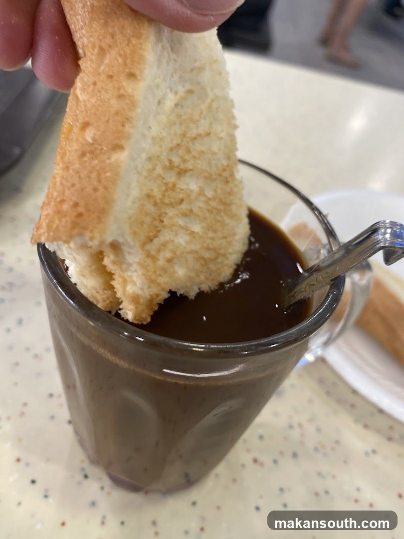 Toast dipping into coffee