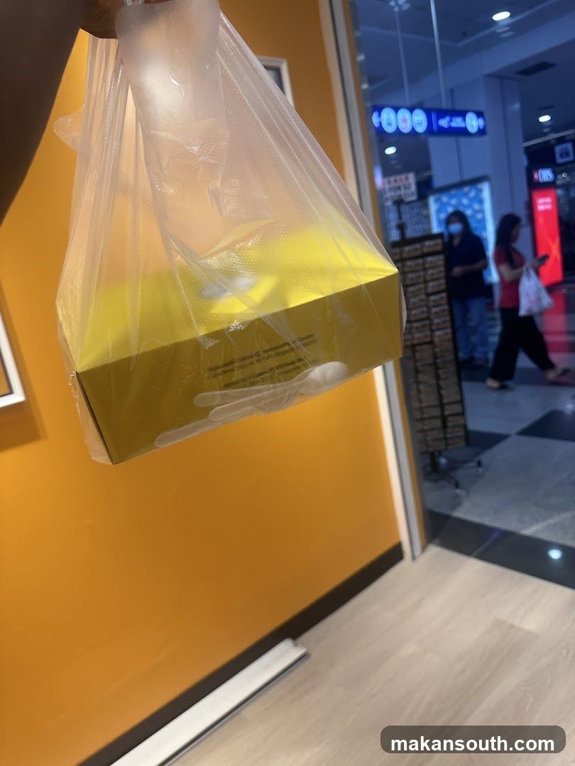 Plastic Bag with Yellow Box