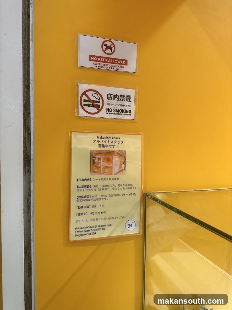 Signage on yellow wall